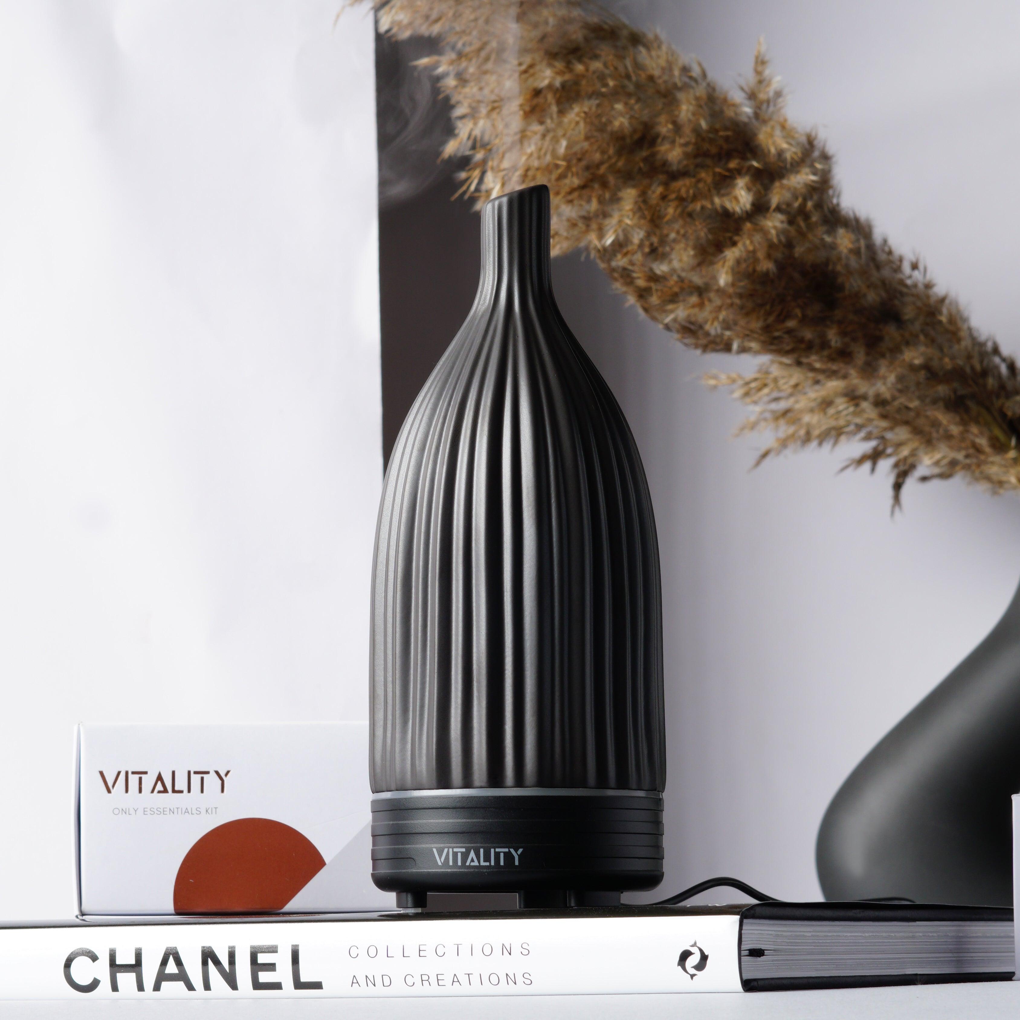 Vitality Aroma Ceramic Striped Black diffuser releasing mist